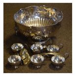 20th Century silver plate on copper punch bowl, six punch cups and ladle Condition: