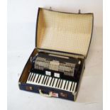 Mid 20th Century cased accordion by Maestro, with 120 buttons and black body in case Condition: