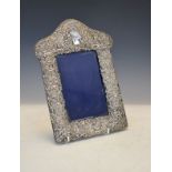 Victorian silver easel picture frame having embossed neo classical scroll and lattice decoration,
