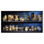Large selection of Torquay Ware souvenir pottery to include a three handled jug vase, assorted motto