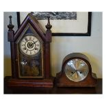 Late 19th Century American temple mantel clock with Roman dial and central alarm dial over coiled