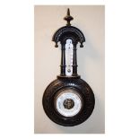 Early 20th Century carved ebonised framed aneroid barometer and thermometer, the off-white dial with