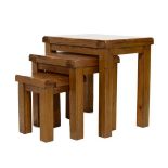 Nest of three modern oak occasional tables, each of rectangular design on square section supports