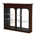 Late Victorian Aesthetic period mahogany wall cabinet having a pair of glazed doors enclosing two