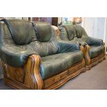 Pair of oak framed green leather two seater settees Condition: