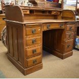 Early 20th Century oak roll top desk, the rectangular top over curved tambour enclosing drawers