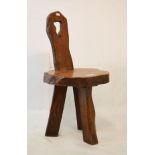 Rustic elm spinning chair with narrow pierced back on shaped seat and three splayed supports