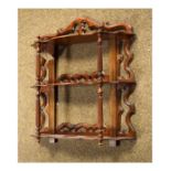 Early 20th Century mahogany wall bracket fitted three shelves supported by slender turned and reeded