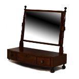 Regency mahogany swing dressing mirror with rectangular plate between blocked and ring turned