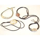Four bolo or bootlace ties, one stamped Sterling Condition: