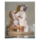 Lladro figure depicting a Japanese lady arranging flowers Condition: