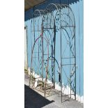 Pair of metal box section rose arbours, together with a wrought iron garden arch Condition: