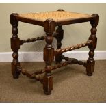 Early 20th Century beech dressing stool having a split cane seat and standing on turned supports