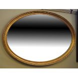 Early 20th Century gilt framed oval wall mirror with bevelled plate Condition: