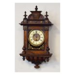 Late 19th Century walnut and beech cased wall clock having a raised pediment, off-white dial with