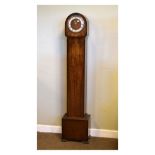 Art Deco style walnut cased three train chiming grandmother clock with arched hood and Roman dial,