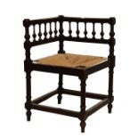 Late 19th Century ebonised string seated corner chair with balustrade on turned supports and plain