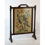 Early 20th Century oak framed fire screen with crewel work panel between barley twist uprights