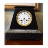 Late 19th Century black and grey slate cased mantel clock, the white enamel dial with Roman