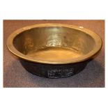 19th Century sheet brass bowl of circular form with rolled rim and flat bottom Condition: