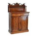 William IV mahogany chiffonier, the raised back with carved pediment, single shelf supported by