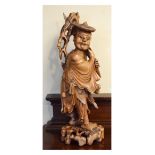 Late 19th/early 20th Century Chinese carved hardwood figure depicting a traveller Condition: