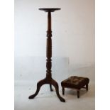 Carved mahogany torchère or lamp stand with dished circular top on spiral carved column and tripod