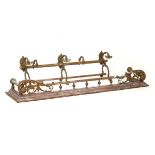 Antique brass and copper towel rail with hooks over two cylindrical rails, together with a copper