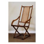 Early 20th Century steamer type folding deck chair with cane back and seat Condition: