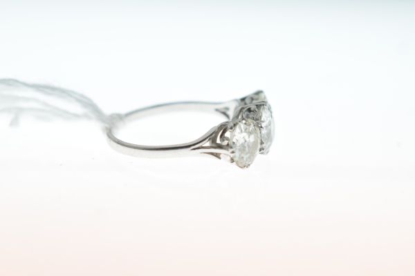 Three stone diamond ring, the white mount unmarked, the graduated old, brilliant cuts calculated - Image 4 of 5