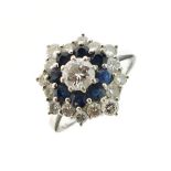 Diamond and sapphire cluster ring, the white mount stamped '18ct', the principal brilliant cut of