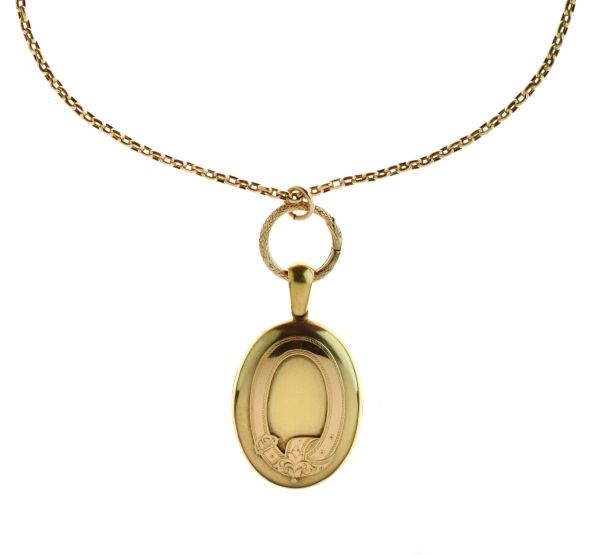 Victorian oval locket, unmarked, with applied garter motif, the glazed interior with styled lock