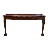 George IV/William IV mahogany serving table of bow-breakfront design with gadroon-carved edge, the