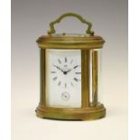 Matthew Norman brass cased oval repeater carriage clock, with white Roman main dial over