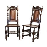 Pair of late 17th Century oak hall chairs, each having a stipple-carved foliate cresting between cup