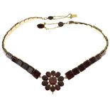 Flat cut garnet necklace, of graduated square stone to a cluster centre, chain link to the clasp,