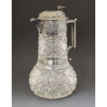 Victorian silver mounted cut glass baluster shaped claret jug, the silver mounts having embossed
