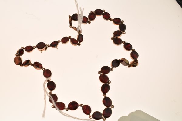 Garnet riviere necklace, the thirty-eight uniform oval cuts in closed back setting, approximately - Image 4 of 6