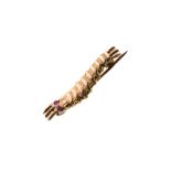 Irvin Caterpillar Club gold pin in the form of a silkworm having two ruby eyes, the reverse