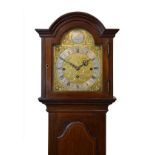 Early 20th Century mahogany cased chiming grandmother clock, having an 8.25 break arched brass dial,