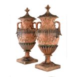 Large pair of Regency style simulated terracotta garden urns, each with pineapple finial over two