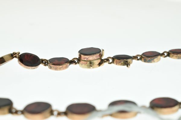 Garnet riviere necklace, the thirty-eight uniform oval cuts in closed back setting, approximately - Image 5 of 6