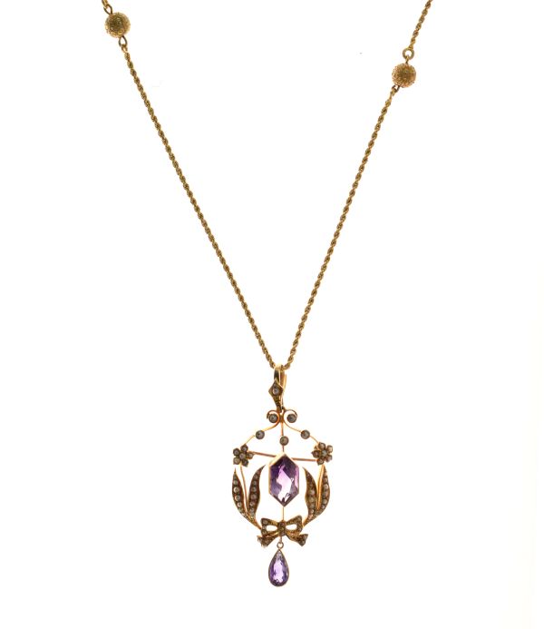 Edwardian amethyst and seed pearl brooch pendant, stamped '15ct' and 'T & S', approximately 5.7cm