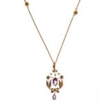 Edwardian amethyst and seed pearl brooch pendant, stamped '15ct' and 'T & S', approximately 5.7cm