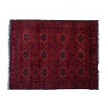 20th Century Middle Eastern wool rug, the crimson field with allover geometric motifs within