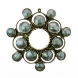 Attributed to the Guild of Handicrafts, a silver gilt and blister pearl brooch, around an open