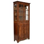 Early 20th Century mahogany cabinet, of inverted breakfront design, the upper stage with arch