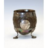 Late 18th/early 19th Century silver mounted carved coconut cup having an engraved circular cartouche
