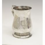 George III silver baluster shaped mug having an acanthus scroll handle and standing on a circular