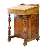 Victorian figured walnut davenport, the hinged cover opening to reveal a partially fitted